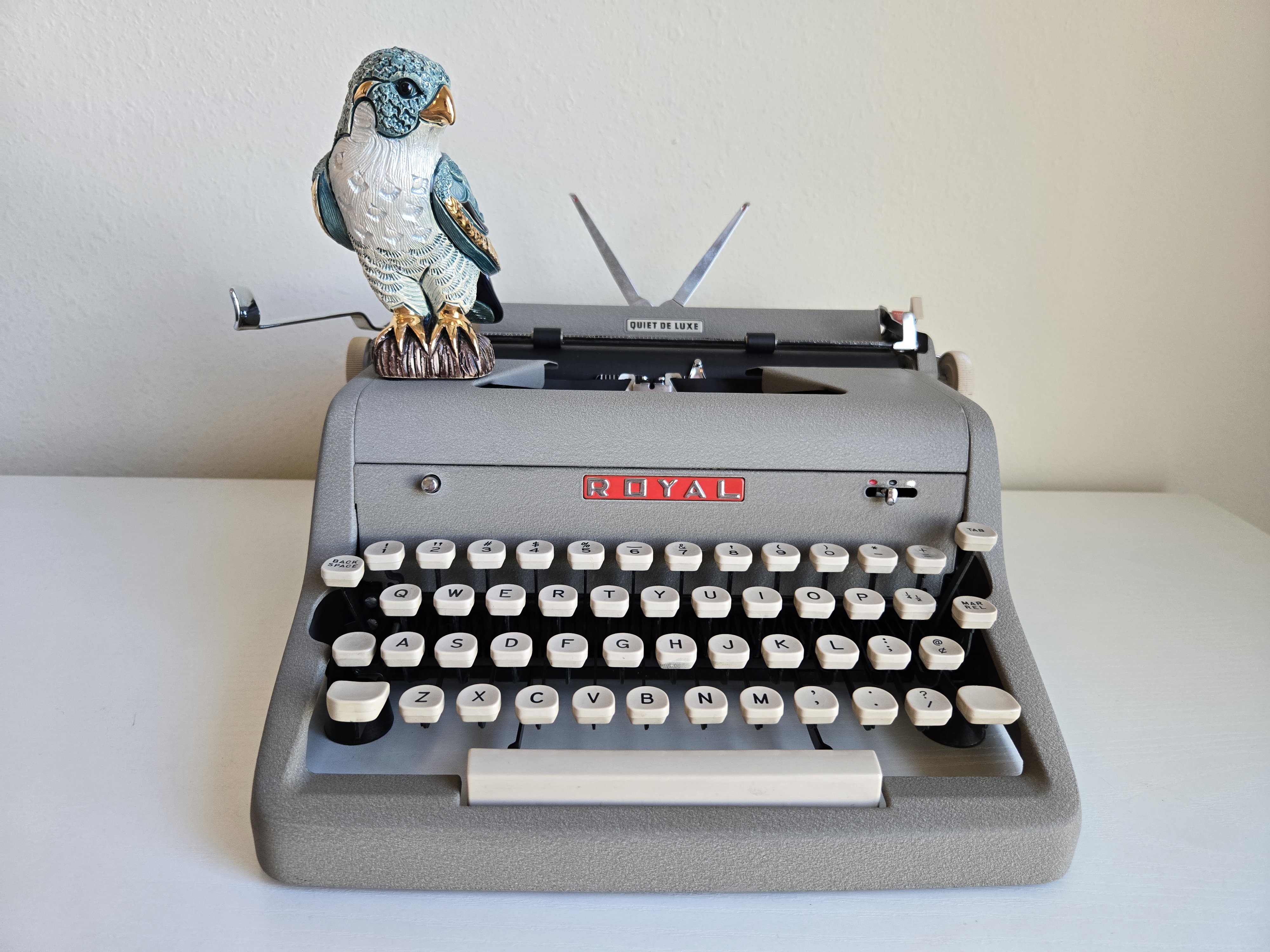 Royal typewriter with falcon figurine
